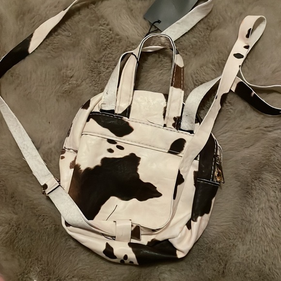 MOVING SALE!! NWT Cow print mini backpack! - Picture 2 of 3
